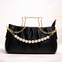 Elegant handbag with pearls and gold chain
