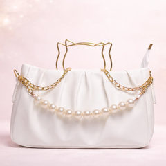 Elegant handbag with pearls and gold chain